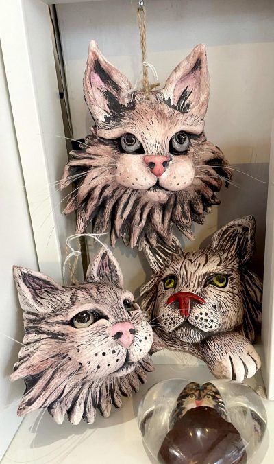 Three Sculpted Ceramic Cat Faces